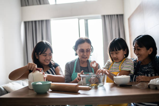 istock Family making a cake at home 1369209380