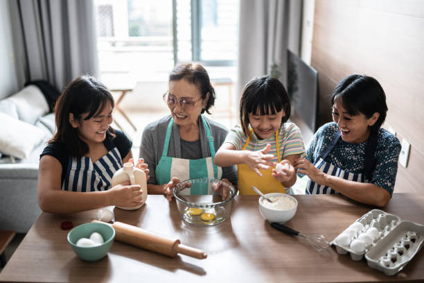 istock Family making a cake at home 1369209382