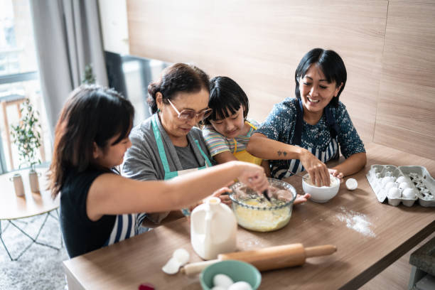 istock Family making a cake at home 1369209393