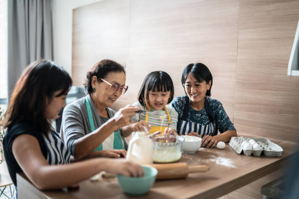 istock Family making a cake at home 1369209398
