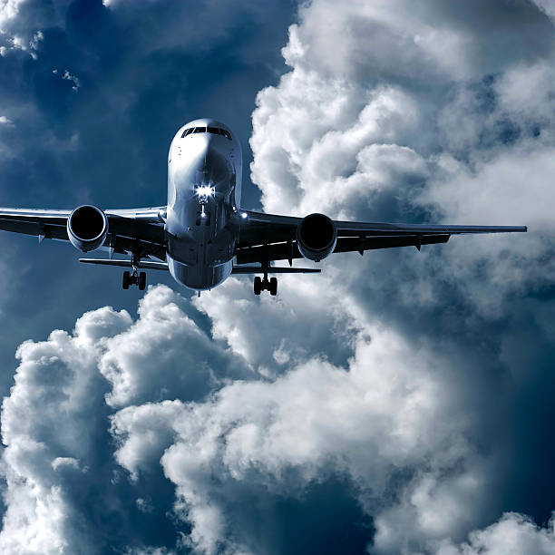 istock jet airplane landing in storm 136921026