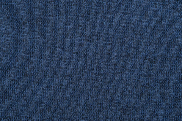 istock Blue knitted jersey texture. Knit cloth background. 1369210944
