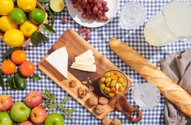 istock Picnic blanket with food on a bright summer or spring day. 1369211264