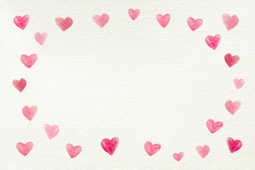 Love background with a frame made by many hearts painted on a recycled white paper for Valentine's Day or other celebrations, letter, copy space