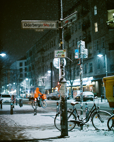 Snowy streets of Berlin Prenzlauer Berg in the evening.