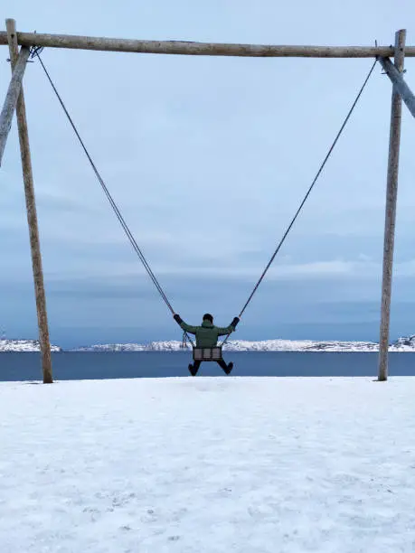 Photo of Swings on the coast of Arctic ocean, the Kola Peninsula, Teriberka, Russia