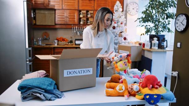 istock Preparing donation boxes during the winter holidays. Christmas charity. 1369224783