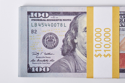 Stack of $ 10,000, ten thousand dollars, isolated on a white background