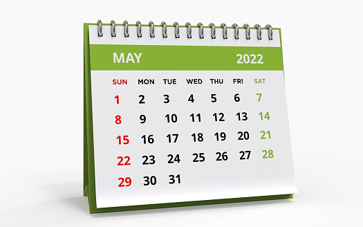 Standing Desk Calendar May 2022. Business monthly calendar with metal spiral-bound, the week starts on Sunday. Monthly Pages on a white base and green title, isolated on a white background, 3d render.