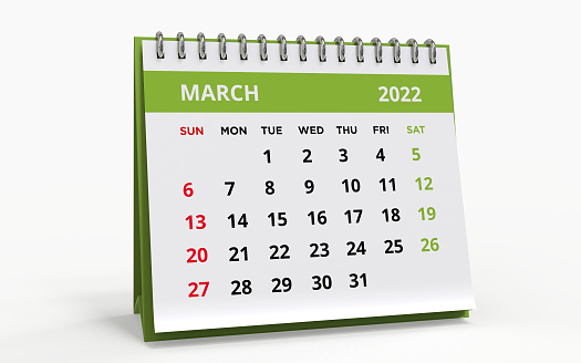 Standing Desk Calendar March 2022. Business monthly calendar with metal spiral-bound, the week starts on Sunday. Monthly Pages on a white base and green title, isolated on a white background, 3d render.