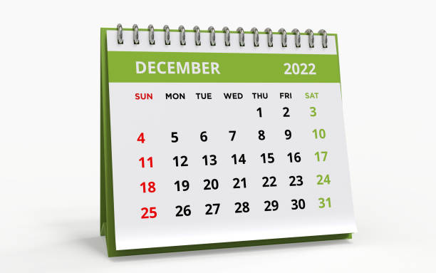Standing Desk Calendar December 2022 green Standing Desk Calendar December 2022. Business monthly calendar with metal spiral-bound, the week starts on Sunday. Monthly Pages on a white base and green title, isolated on a white background, 3d render. december stock pictures, royalty-free photos & images