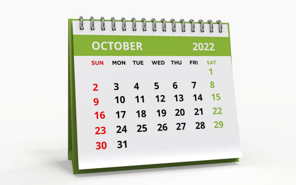Standing Desk Calendar October 2022 green Standing Desk Calendar October 2022. Business monthly calendar with metal spiral-bound, the week starts on Sunday. Monthly Pages on a white base and green title, isolated on a white background, 3d render. october stock pictures, royalty-free photos & images