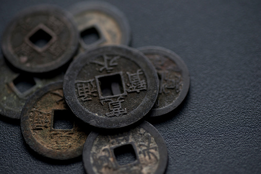 Close-up of Kan'ei Tsuho, an ancient coin from Japan's Edo period.