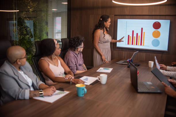 istock Businesspeople talking in meeting 1369232335