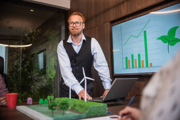 istock Businesspeople talking about renewable energy 1369232404