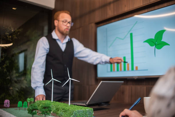 istock Businesspeople talking about renewable energy 1369232407