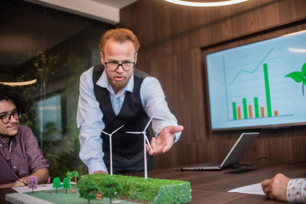 istock Businesspeople talking about renewable energy 1369232414
