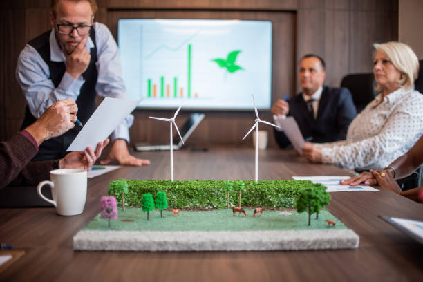 istock Businessmen talking about wind energy 1369232418