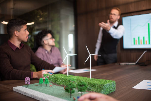 istock Businesspeople discussing about renewable sources 1369232436