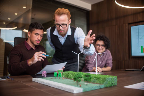 istock Businesspeople discussing about renewable sources 1369232438