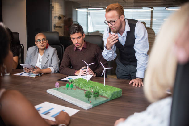 istock Businesspeople discussing about renewable sources 1369232444