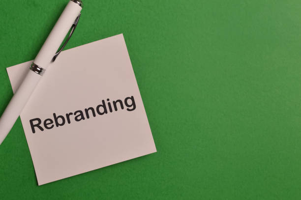 istock Top view of pen and memo note written with text REBRANDING 1369233251