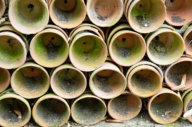 a picture of a Stack of orange ceramic pottery bowls
