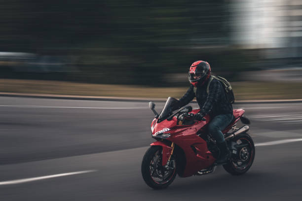 The biker an image of a motorbiker moving very fast.  taken at Upper Hanover Street, Sheffield. United Kingdom - 22 September 2021 motorcycle stock pictures, royalty-free photos & images