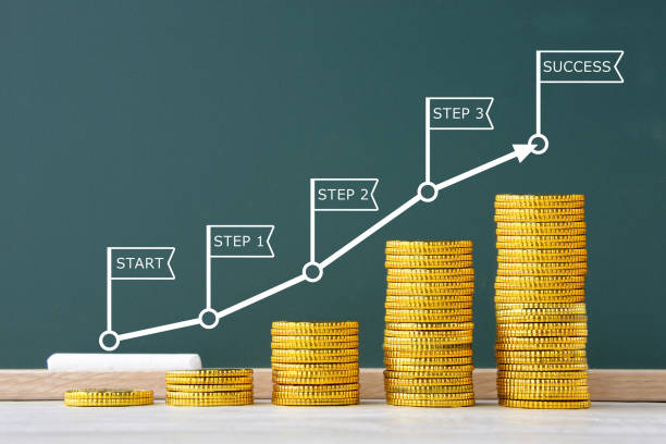 istock Money gradually piled highly and precess from start to goal 1369238781