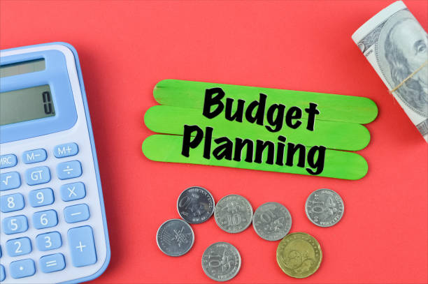 istock Green ice cream sticks written with BUDGET PLANNING over red background. 1369238817