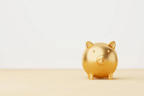 Photo of Save money and investment concept. Gold piggy bank on wood table. 3d rendering illustration