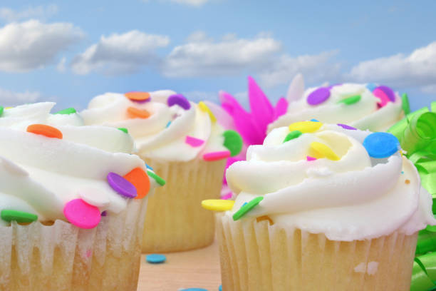 istock Cupcakes with white icing and Colorful Sprinkles 1369239698