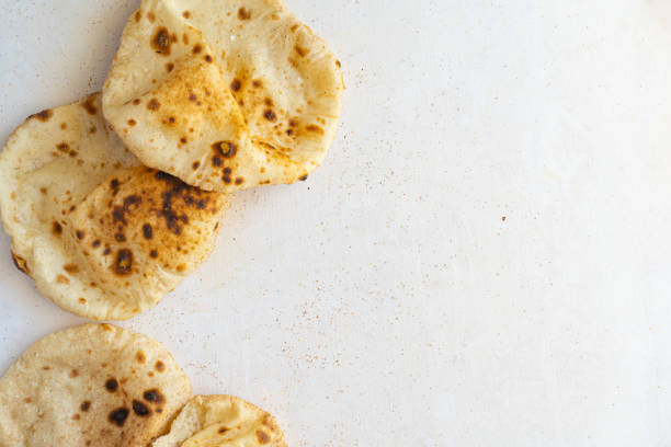 istock Flat lay of Freashly baked arab flatbreads 1369240905