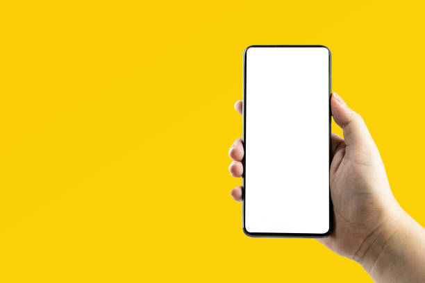 istock Hand holding a black smartphone 1369243278