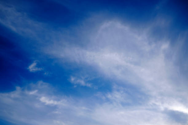 White Clouds On The Blue Sky On Sunny Day , Blue sky and clouds. Beautiful cloudscape over horizon Beautiful landscape with shiny light blue sky, clouds and sunlight on a clear day