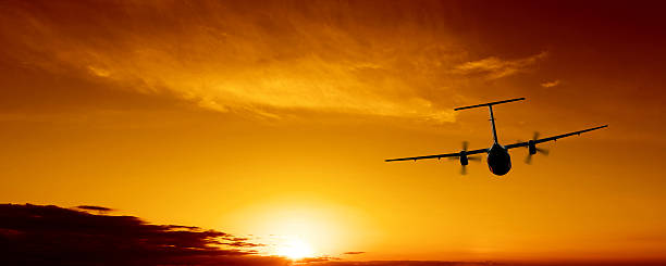 istock propeller airplane flying at sunset 136924446