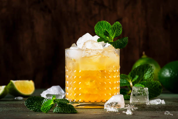 Mai Tai trendy alcoholic cocktail with rum, liqueur, syrup, lime juice, mint and crushed ice. Dark background, copy space Mai Tai trendy alcoholic cocktail with rum, liqueur, syrup, lime juice, mint and crushed ice. Dark background, copy space crushed stock pictures, royalty-free photos & images