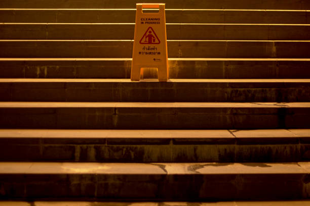 Yellow Caution wet floor cleaning in progress sign on wet floor , Attention notice symbol for prevention and clean progress Cleaning and disinfection of the area