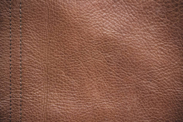 istock Genuine leather texture background. Dark brown, orange textures for decoration blank. Vintage skin natural suede with design line pattern or red abstract can use wallpaper or backdrop luxury event. 1369250925