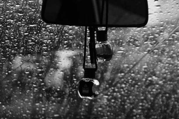 istock raindrops wet the windshield. water dew blcak and white 1369251638