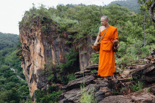 istock Monks pilgrimage in the forest, keeping the precepts 1369252061