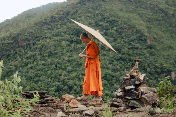 istock Monks pilgrimage in the forest, keeping the precepts 1369252079