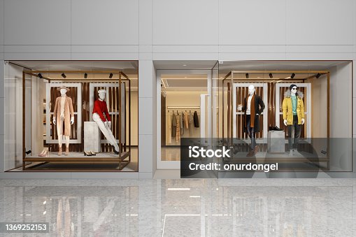 istock Exterior Of Clothing Store With Women's And Men's Clothing On Mannequins Displaying In Showcase. 1369252153