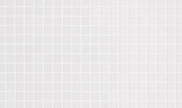 istock White or gray ceramic wall and floor tiles abstract background. Design geometric mosaic texture decoration of the bedroom. Simple seamless pattern for backdrop hospital wall, canteen and grid paper. 1369252237