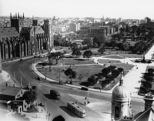 Historical Hyde Park Sydney. Historical Hyde Park Sydney and St Mary's cathedral from Macquaie street 1934." hyde park sydney stock pictures, royalty-free photos & images
