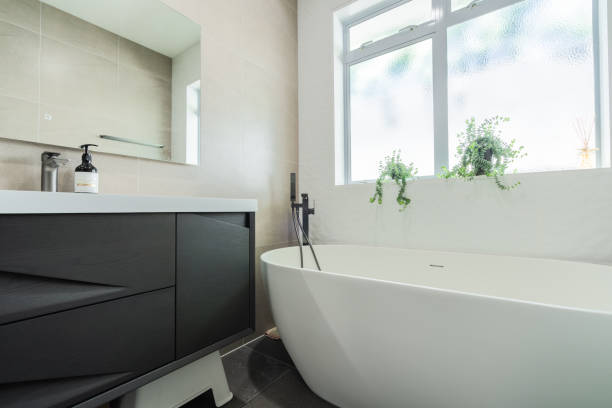 istock Closeup of bathtub in bathroom. 1369259352