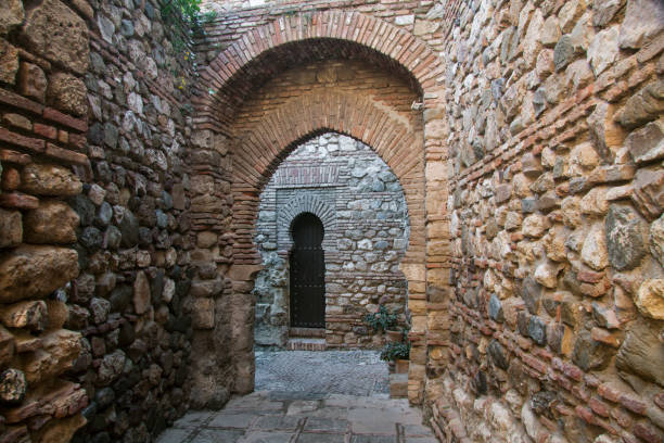Spain - Malaga - The hidden stone passageway in Malaga fortress (Alcazaba de Malaga) with archs and doors
