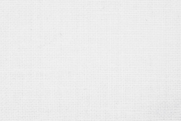 istock White fabric jute hessian sackcloth canvas woven gauze texture pattern in light white color blank. Natural linen and cotton cloth texture as clean background empty for decoration. 1369260547