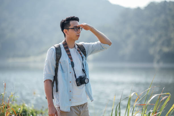istock Traveler looks at landscape 1369261749