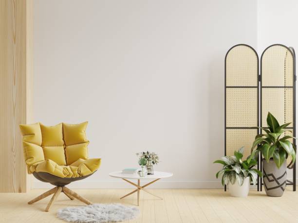istock Modern living room interior with yellow armchair on empty white wall. 1369261998